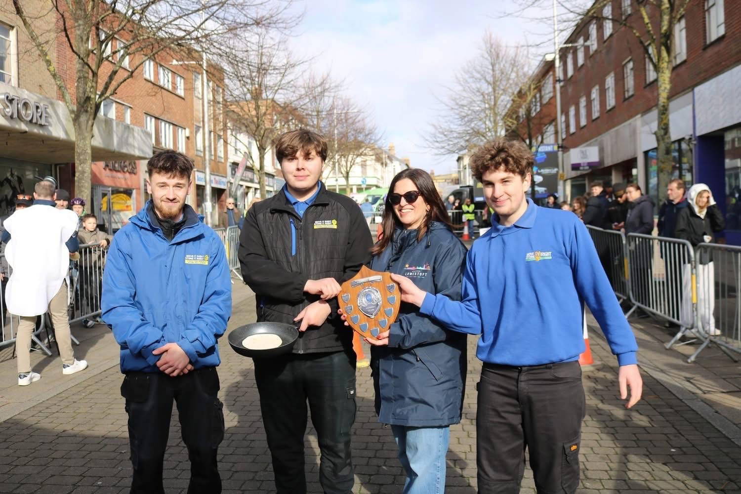 The winning team celebrating at the 2026 pancake race